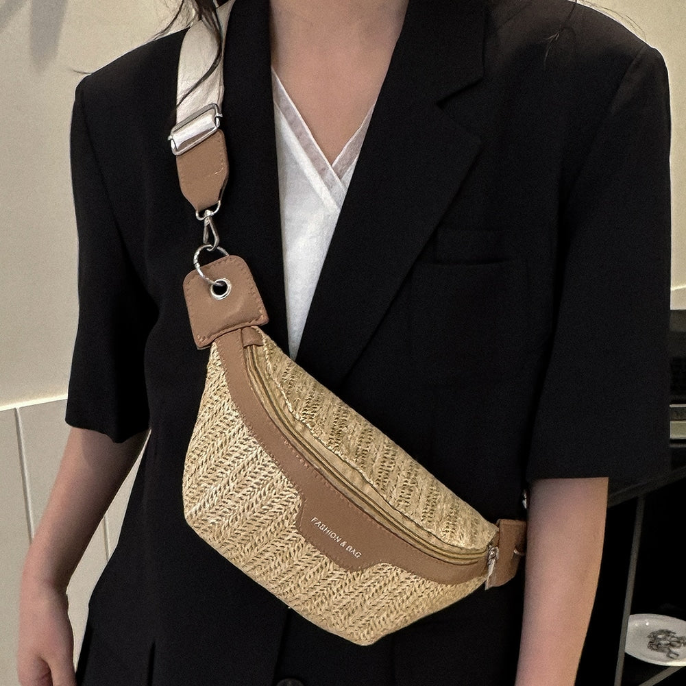 Small elongated woven straw sling bag with an adjustable strap