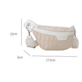 Small elongated woven straw sling bag with an adjustable strap