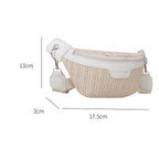 Small elongated woven straw sling bag with an adjustable strap