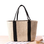 Tightly woven straw handbag with an adjustable strap and inner phone pocket