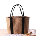 Tightly woven straw handbag with an adjustable strap and inner phone pocket