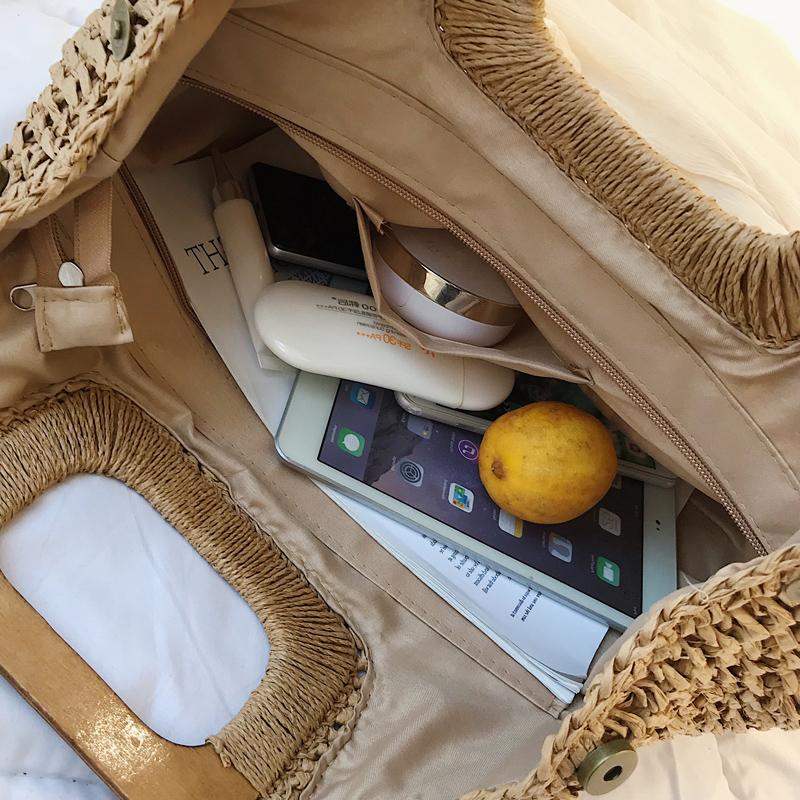 Woven straw tote bag with varnished wooden handles in beige or brown