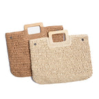 Woven straw tote bag with varnished wooden handles in beige or brown