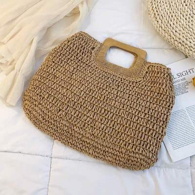 Woven straw tote bag with varnished wooden handles in beige or brown