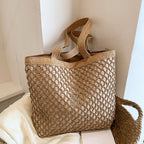 Structured woven tote bag with a top zip closure in blue or beige