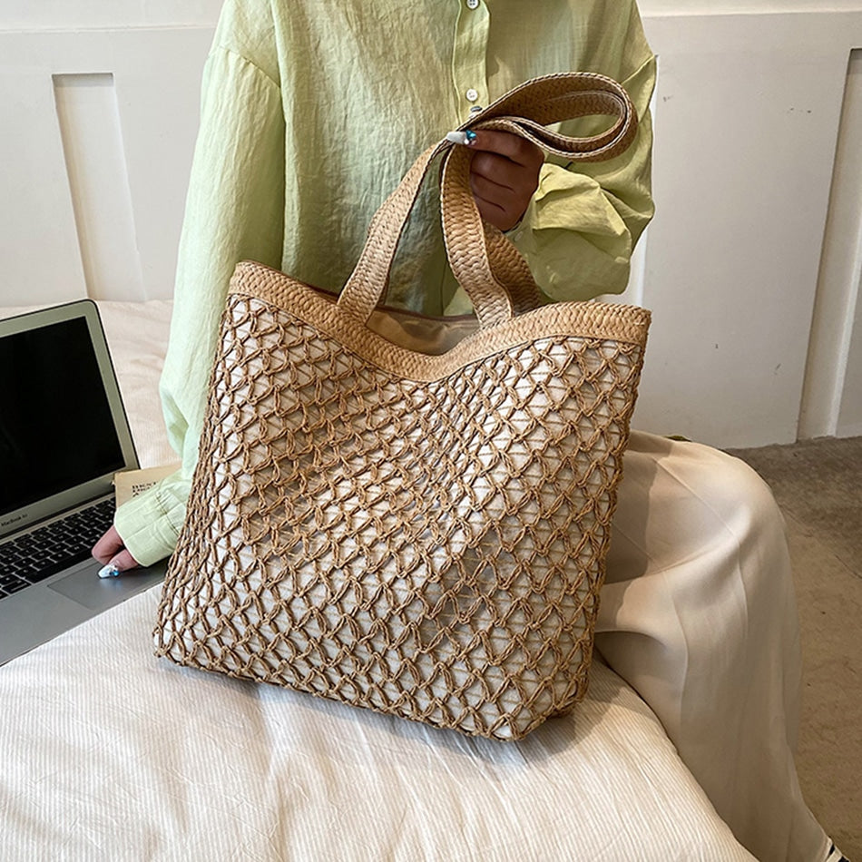 Structured woven tote bag with a top zip closure in blue or beige