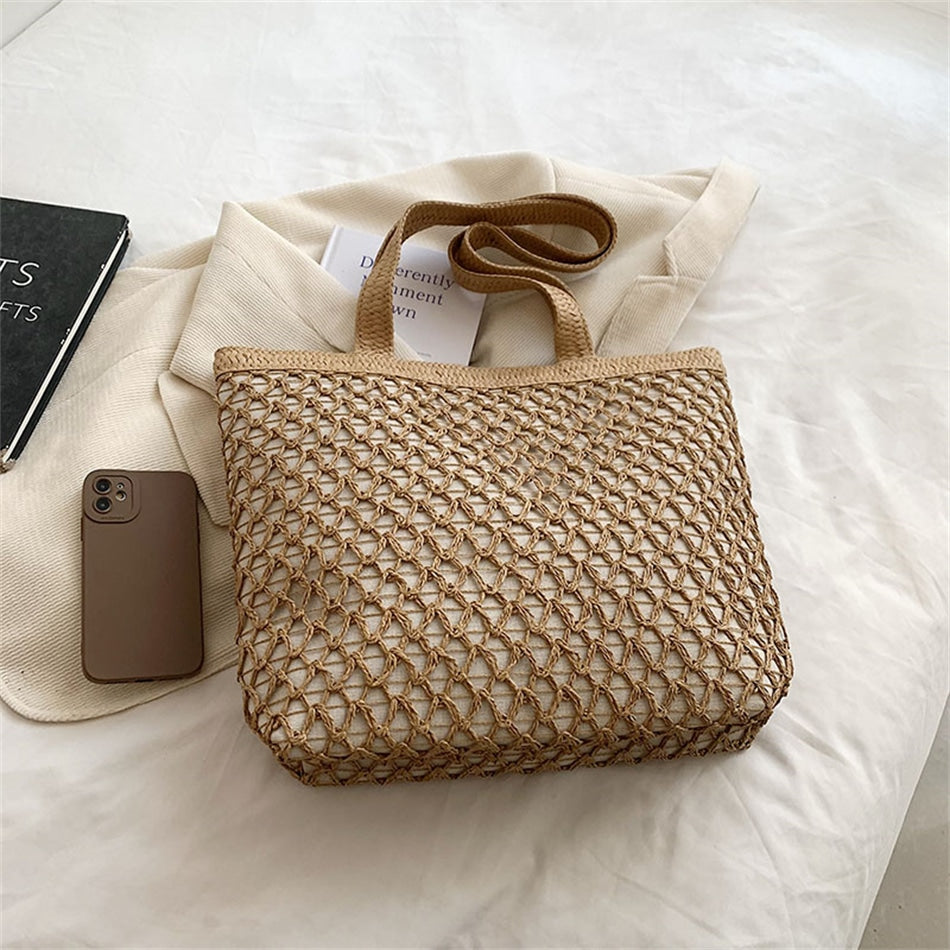 Structured woven tote bag with a top zip closure in blue or beige