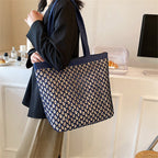 Structured woven tote bag with a top zip closure in blue or beige