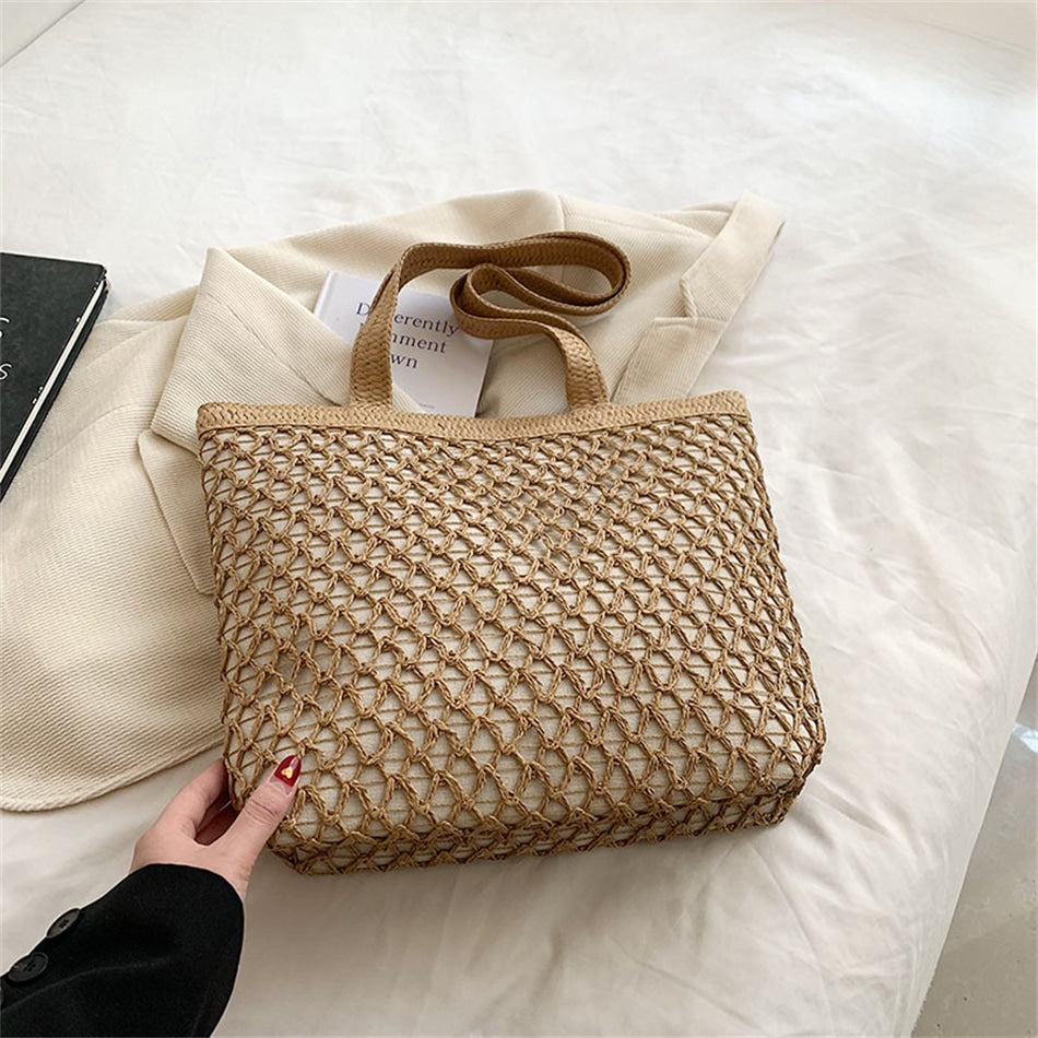 Structured woven tote bag with a top zip closure in blue or beige