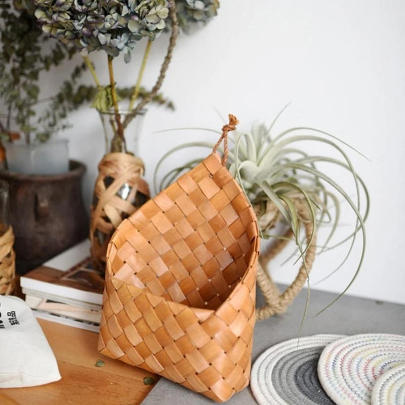 Checkerboard woven wall pocket holding air plants