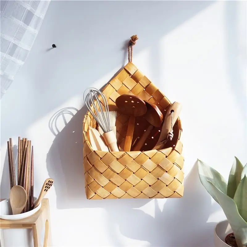 Checkerboard woven wall pocket holding air plants
